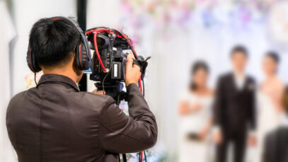 professional videographer recording wedding ceremony day