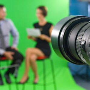 Recording live talk show between journalist and star at tv green screen studio